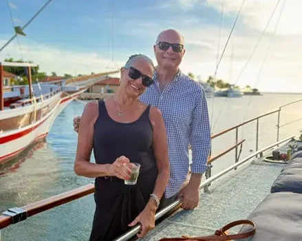 A couple on a small sailing vessel
