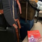 suticases and book at airport