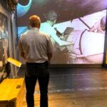 Man appreciating on of the exhibits at the National WWII Museum