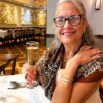 woman enjoying brunch at Luke on St Charles Ave in New Orleans