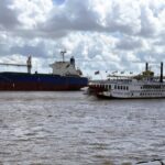 Two Ships passing on the Mississippi River with 200 years between them
