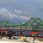 Crescent City Connection lit up in green for St Patrick's Day