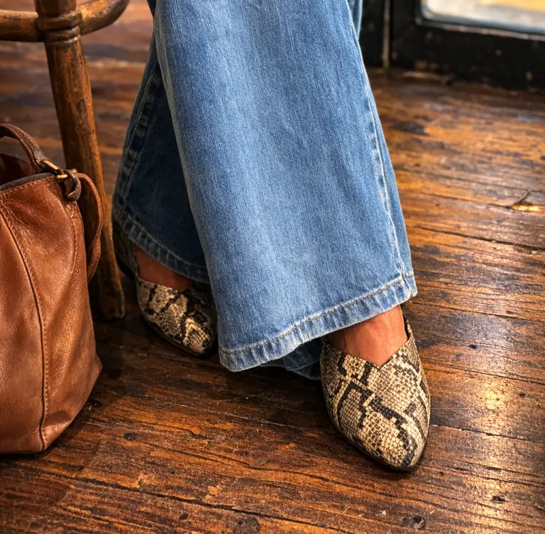lady in jeans and snake skin shoes