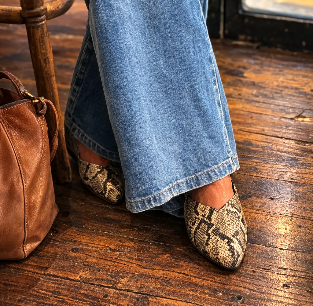 lady in jeans and snake skin shoes
